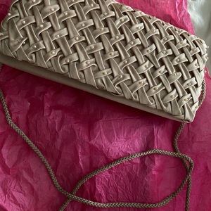 Taupe clutch with access to strap